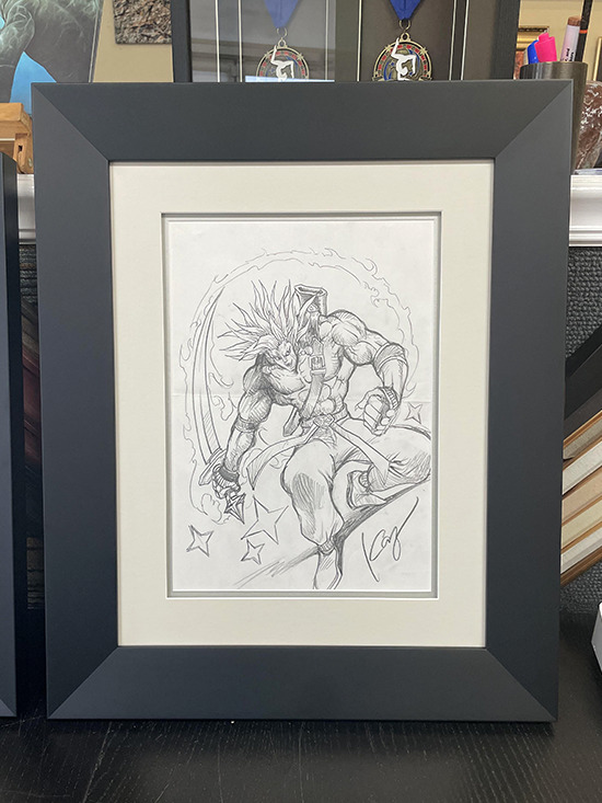 Unused concept art for Tyler the Great Warrior illustrated by Kazuki Takahashi in a picture frame